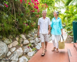 Couple walking outside hotel in gardens