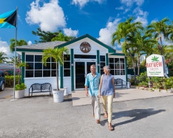 Couple walking by Bay View Suites Entrance